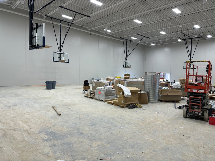 auxiliary gym. 4 of the 6 hoops installed. Batting cage coming up next  